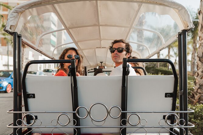 Malaga Expert Tour with Local Guide in Eco Tuk Tuk Private - La Farola Lighthouse and La Malagueta Beach: A Photo Pair That Feels Like One Story