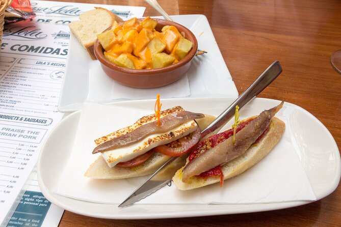 Malaga Food Tour: Tapas, Drinks and Delights with a Local - Stop 4 in Plaza de la Merced: honey aubergines and the square’s old pulse