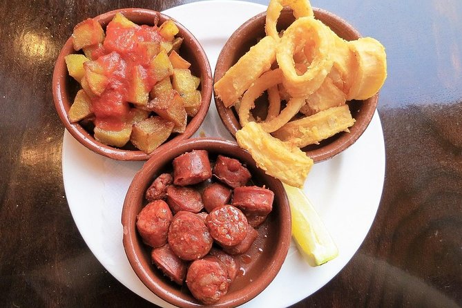Malaga Market Food Tour: Tapas, Drinks, and Local Flavors - Stop 1 near 29005: warm-up bites and a feel for the streets