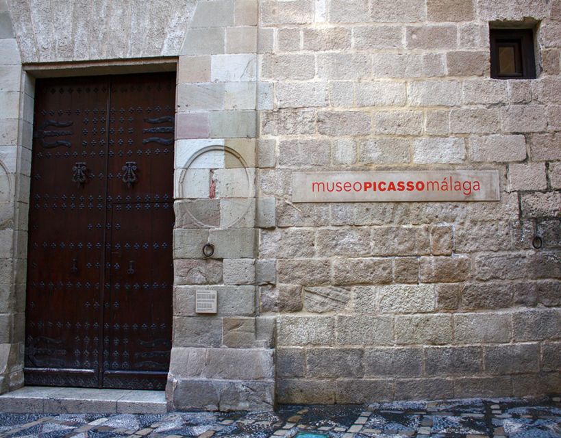 Malaga: Picasso Museum Guided Tour with Skip-the-Line Ticket - Meeting the guide: the yellow umbrella at the museum entrance
