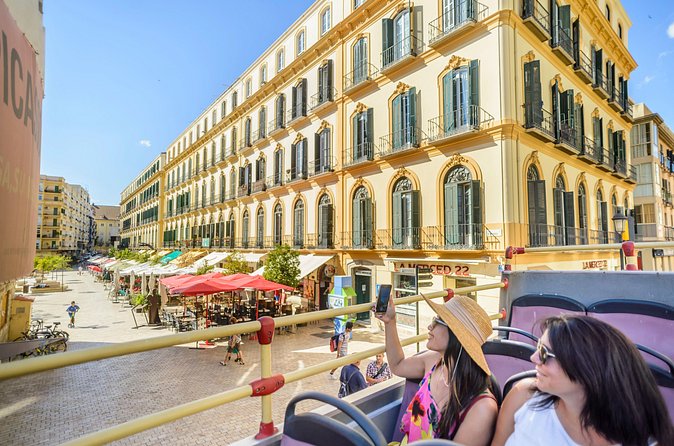 Malaga Shore Excursion: City Sightseeing Malaga Hop-On Hop-Off Bus Tour - Boarding lines, heat, and audio quirks: the practical realities