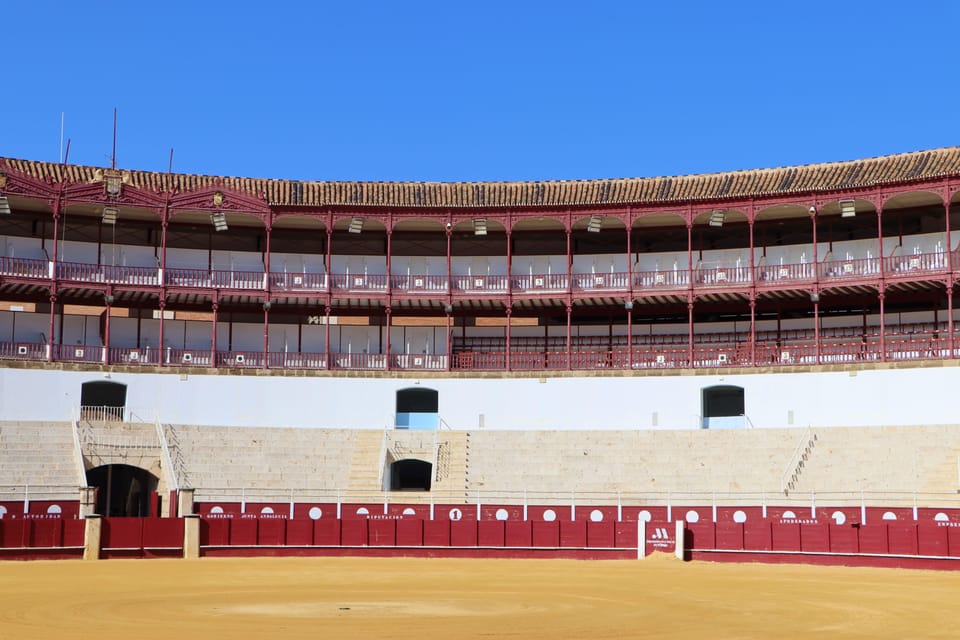 Malaga: Tour of Malagueta Bullring & Immersive Exhibition - Gate of Triumph, chapel, infirmary: your self-guided walk through the building