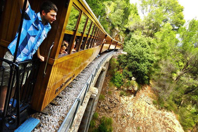 Mallorca in One Day Sightseeing Tour with Boat Ride and Vintage Train - Start in Palma, with pickup options that affect your morning