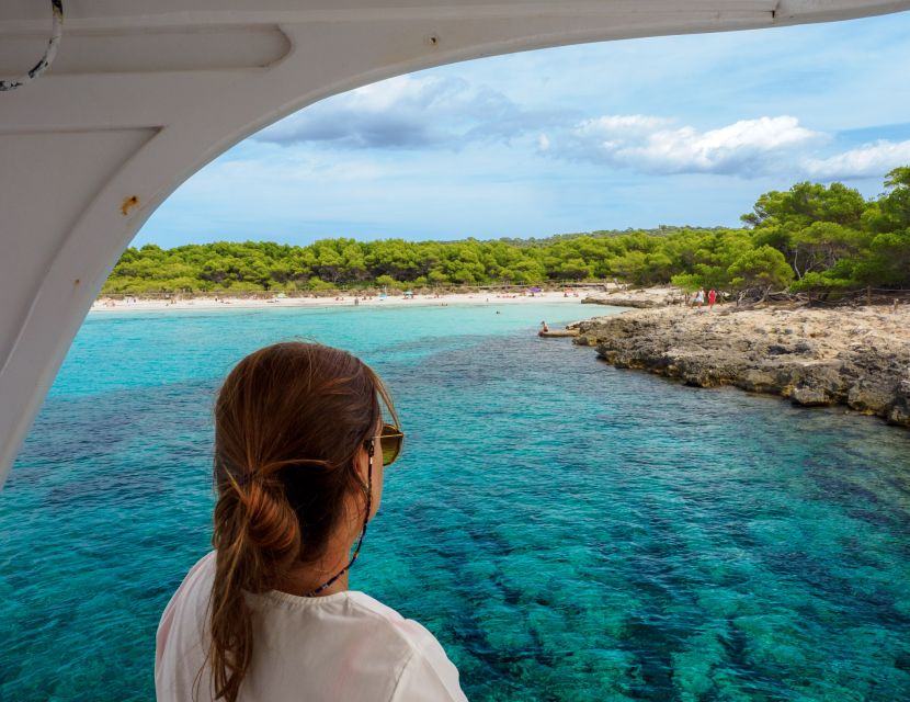 Menorca: Full-Day Boat Tour with Paella Lunch - Leaving the first cala: the boat cruise past Macarella and Macarelleta