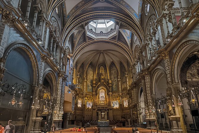 Montserrat Tour by Train with Cable Car and Cogwheel - The monastery intro walk: history you can use (and what you still need to pay for)