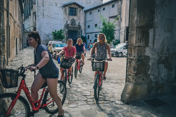 Palma de Mallorca Bike Tour - Old Town streets: convent stop, city hall, olive tree, and Passeig des Born