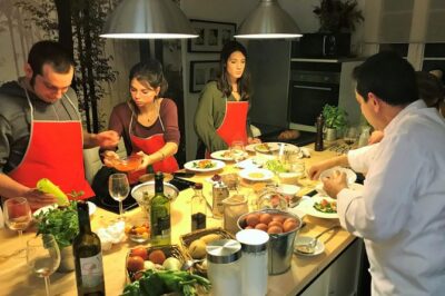 Premium Paella Cooking Class & 10 Spanish Tapas - Finding the kitchen: Placa Reial meets a stair-climbing challenge
