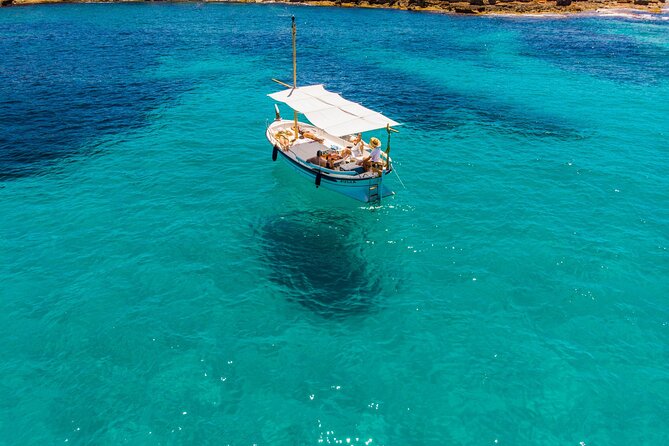 Private 4-hour Mediterranean Boat Tour in Ibiza with Snorkeling - Stop 1: Cala Comte for snorkel breaks and sunset timing