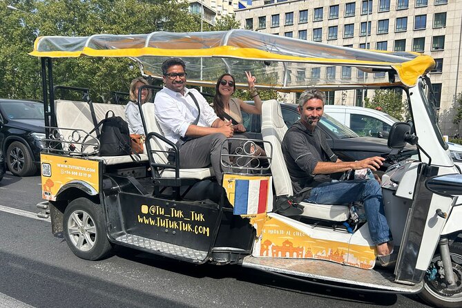 Privately Guided Panoramic Tour in Yellow Tuk Tuk from Madrid - Puerta de Alcalá to Salamanca: a shift toward classic grand avenues