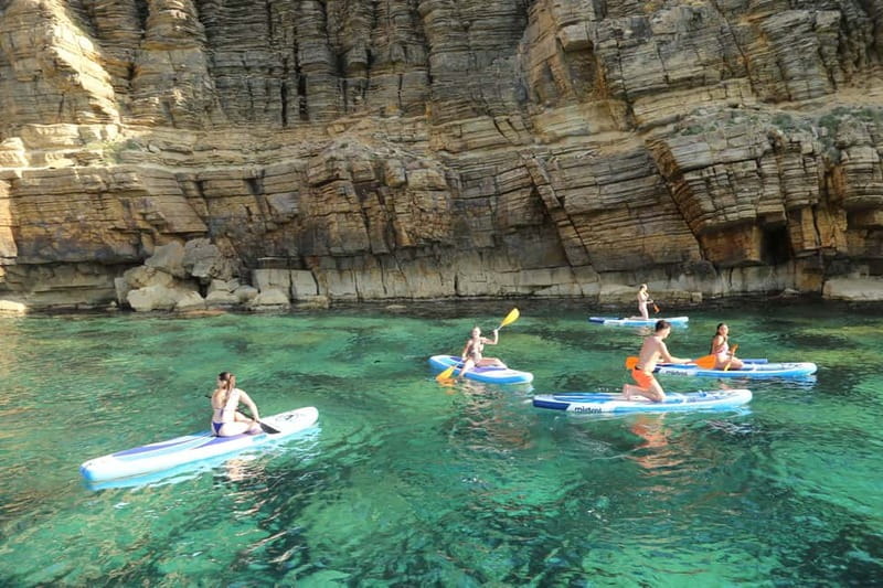 San Antonio: Cala Bassa, Cala Conta and Cave Boat Trip - Cala Conta Beach Break: Walk, Snorkel, or Paddle Surf