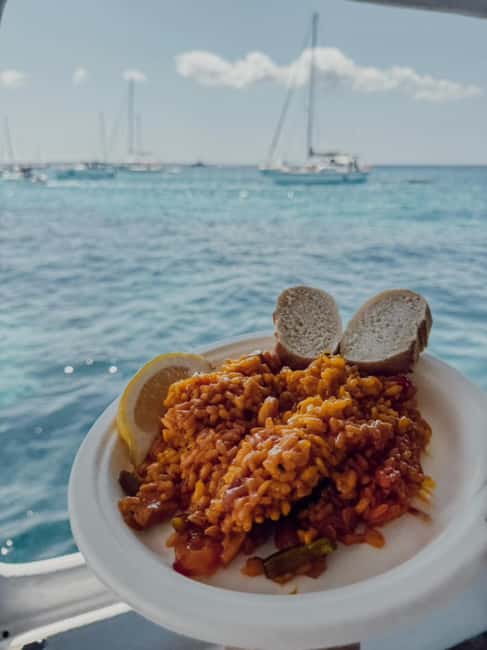 San Antonio: Es Vedrà, Formentera Tour with Food & Drinks - The sunset cava toast and the return cruise past Café Mambo