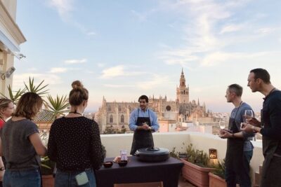 Sevilla: Rooftop Paella Cooking Class & 30-minute expert Q&A - Meeting at Columnas Romanas and Climbing to Your Rooftop Kitchen