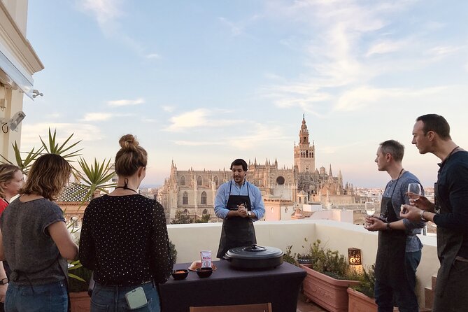 Sevilla: Rooftop Paella Cooking Class & 30-minute expert Q&A - Meeting at Columnas Romanas and Climbing to Your Rooftop Kitchen