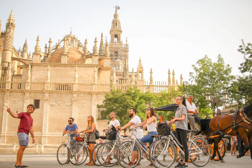 Seville: City Sightseeing and Local Culture Bike Tour - Where You Start: Mercado del Arenal stand 48, then roll out fast