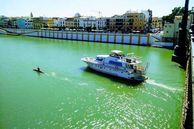 Seville: Cruise along the Guadalquivir River with appetizer - Getting on the Water: Muelle Nueva York and Juan Sebastián Elcano