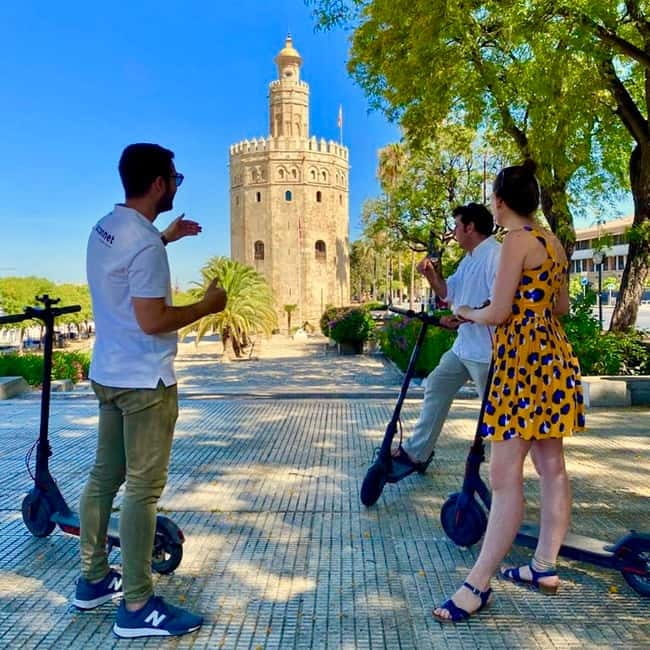 Seville: Electric Bike City Tour - Riverfront opener: Torre del Oro and Puente de Isabel II
