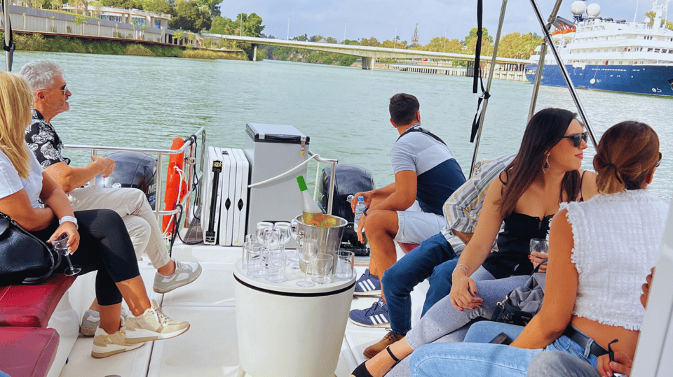 Seville: Guadalquivir River Boat Tour - Onboard vibe: drinks, music, and how the captain keeps it moving