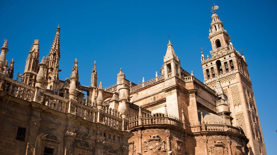 Seville: Guided Tour with Cathedral & Giralda Entrance - Inside the Cathedral: dress code, silence, and what your guide will focus on
