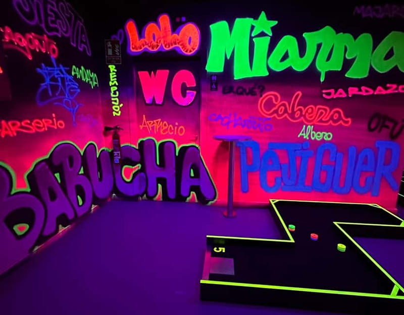 Seville: Indoor UV 18 hole Minigolf Experience - The Bar, Seating Area, and Locker Storage