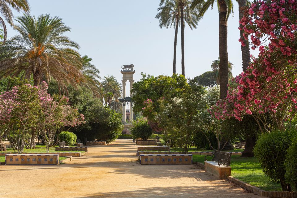 Seville: Relaxing City Bike Tour with a Tour Guide - Antigua Fábrica de Tabacos: A Major Stop You Might Miss on Foot