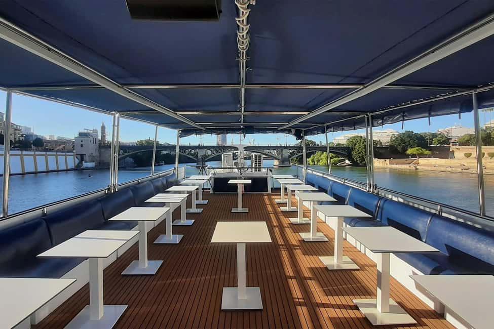 Seville: Restaurant Boat Ride on the Guadalquivir with Lunch/Dinner - A 2.5-hour floating break from Seville’s streets