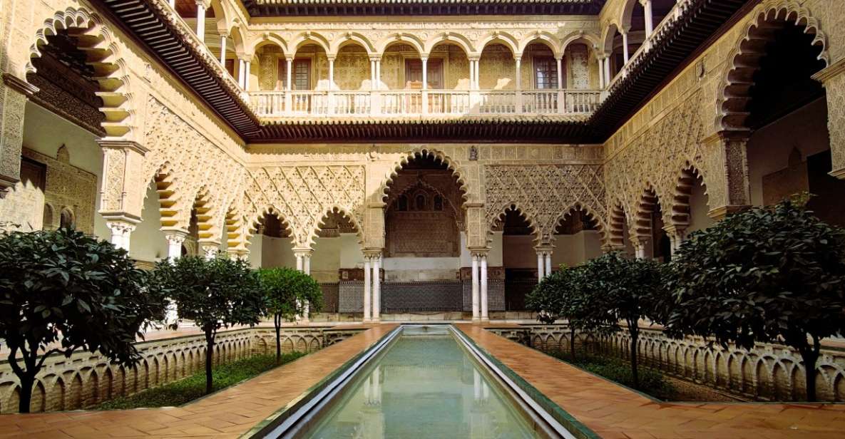 Seville: Small-Group Alcázar Guided Tour & Entry Ticket - Meeting point and first impressions at Plaza del Triunfo
