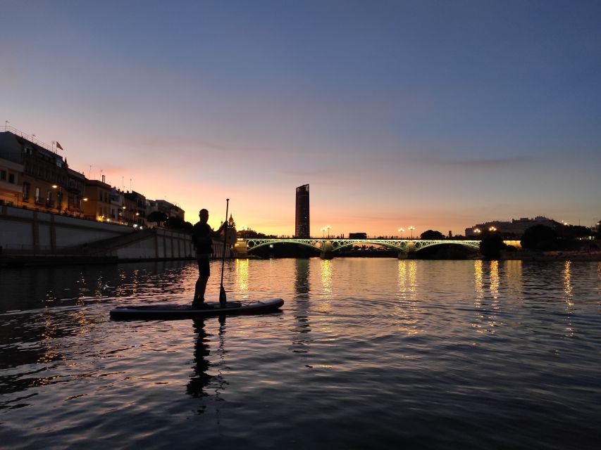 Seville: Sunset and Evening Paddle Boarding Tour - Night on the Guadalquivir: why this view hits different