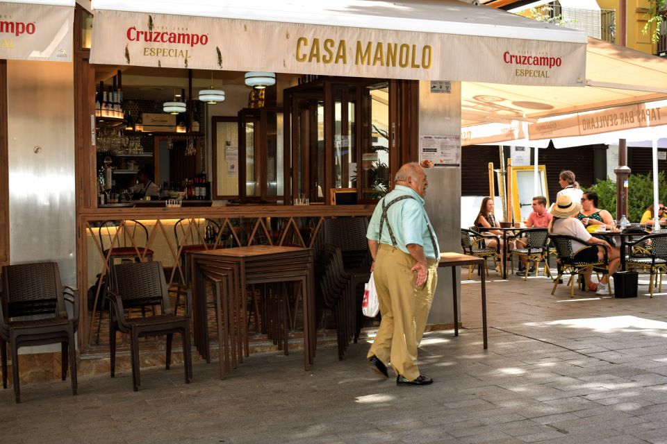 Seville: Tapas, Taverns, and History Walking Tour - Start with flaming chorizo and barrel vermouth