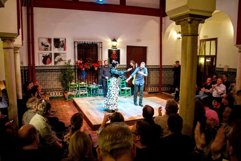 Seville: Tapas Walking Tour with Traditional Flamenco Show - Stop one: cured meats, beer or wine, and vermouth timing