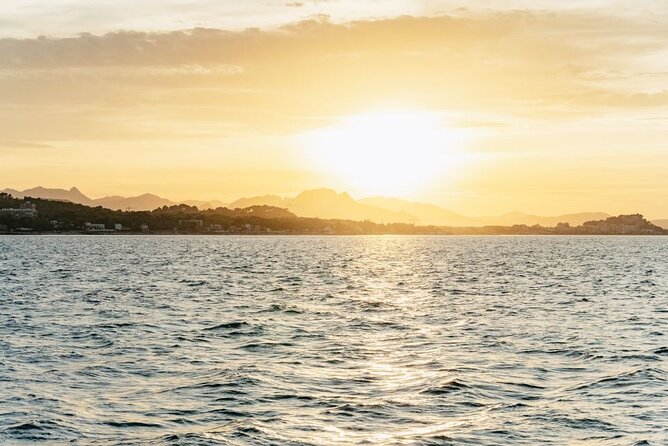 Sunset in Dénia from the Catamaran Mundo Marino - Bow Nets and Photo Goals: Limited Space Means Ask Early