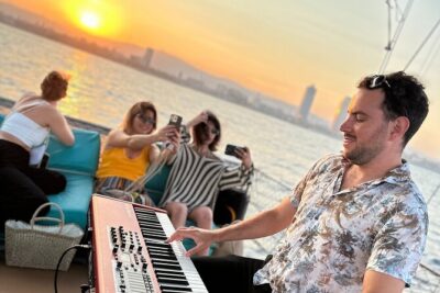 Sunset Sailing in Barcelona & Live Music by Aperol - The boat and deck setup: rooftop views, but plan for conditions