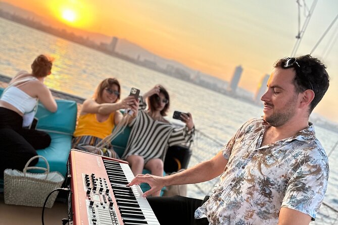 Sunset Sailing in Barcelona & Live Music by Aperol - The boat and deck setup: rooftop views, but plan for conditions