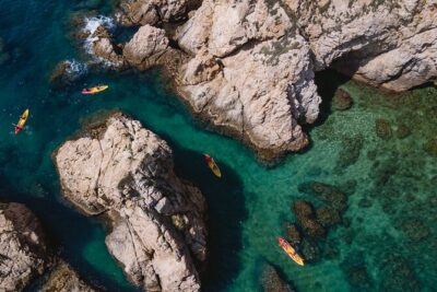 Tossa de Mar: Kayak & Snorkel Tour with Paella from Barcelona - Entering the Kayak Route: Coves, Caves, and Wildlife Chances