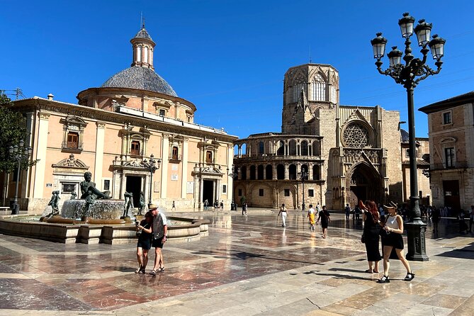 Valencia City Highlights in Guided Bike or E-Bike Tour - Palau de la Generalitat and Torres de Serranos: power symbols from two angles