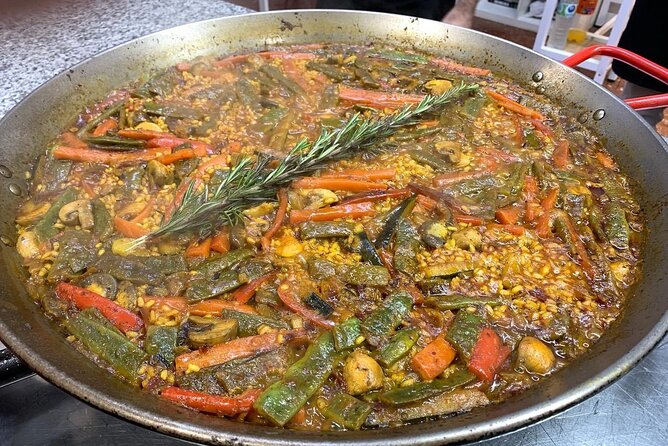 Vegetable Paella cooking class, tapas and Ruzafa market visit - The food program: tapas, tomato salad, and the paella finish